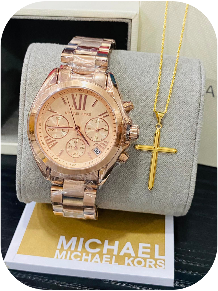 Michael Kors wristwatch paired with a gold cross pendant necklace