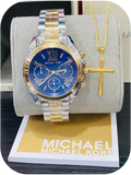 Michael Kors wristwatch paired with a gold cross pendant necklace